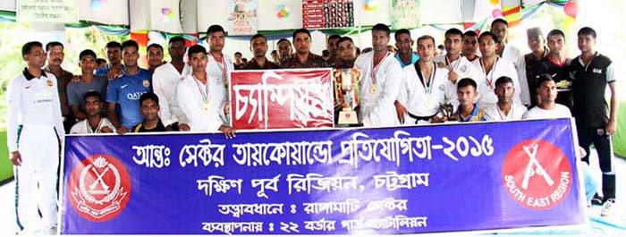 BGB Rangamati Sector, the champions of the Chittagong South East Inter-Sector Taekwondo Competition with the guests pose for photograph at the Rangamati BGB Sector in Rangamati on Tuesday.