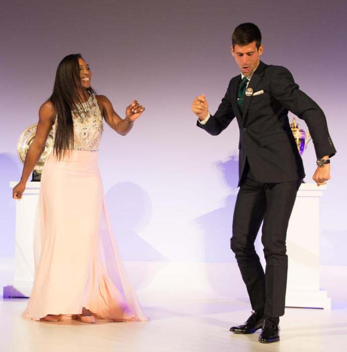 Serena Williams of the United States and Novak Djokovic of Serbia dance on stage at the Champions Dinner at the Guild Hall on day thirteen of the Wimbledon Lawn Tennis Championships at the All England Lawn Tennis and Croquet Club on July 12, 2015 in Londo