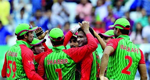 Bangladesh cricketers congratulate Shakib Al Hasan (C) after the dismissal of South African captain Hashim Amla during the second One Day International match between Bangladesh and South Africa at the Zohur Ahmed Chowdhury stadium in Chittagong on Wednes
