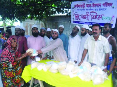 JAMALPUR: Eid items being distributed by Dewanbari Al -Easan Parishad in Melandah Upazila on Monday.