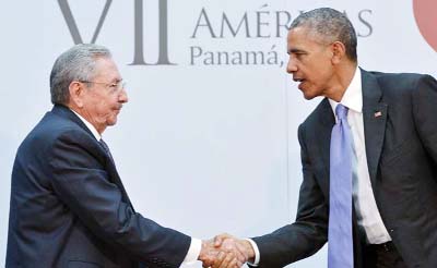US President Barack Obama shakes hands with Cuba's President Raul Castro during a meeting.