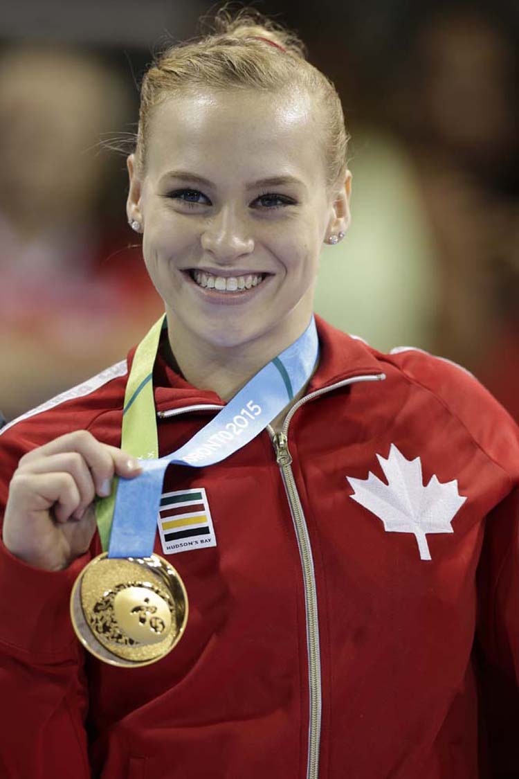 Canada's Ellie Black poses wearing her gold medal after winning it in women's artistic gymnastics balance beam competition in the Pan Am Games in Toronto on Wednesday. Black won two gold medals Wednesday, in floor exercise and balance beam.