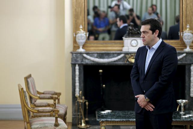 Greek Prime Minister Alexis Tsipras looks on during a swearing in ceremony of members of his government at the Presidential Palace in Athens, Greece July 18, 2015. ReutersAlkis Konstantinidis