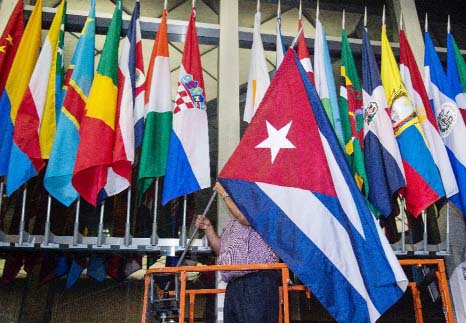 The Cuban flag is added to a display of flags at the US State Department in Washington.