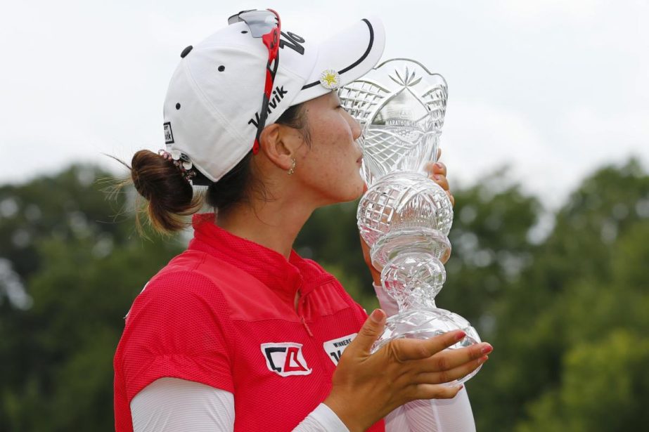 Chella Choi of South Korea kisses her trophy after winning the Marathon Classic golf tournament on the first playoff hole at Highland Meadows Golf Club in Sylvania, Ohio on Sunday.