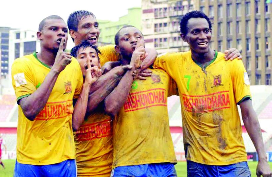 Players of Sheikh Jamal Dhanmondi Club Limited celebrate after beating Sheikh Russel Krira Chakra by 4-3 goals in their football match of the Manyavar Bangladesh Premier League at the Bangabandhu National Stadium on Tuesday.