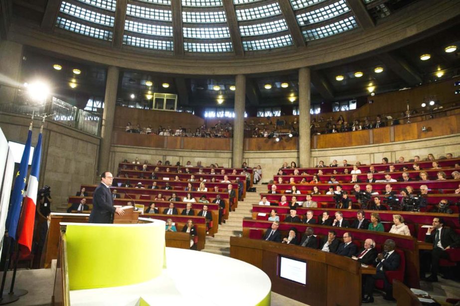 French President Francois Hollande delivers a speech during the opening of the Consciouness Summit in Paris, France on Tuesday.