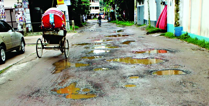 FARIDPUR: Dilapidated Sonali Bank road in Faridpur city needs immediate repair. This picture was taken on Tuesday.