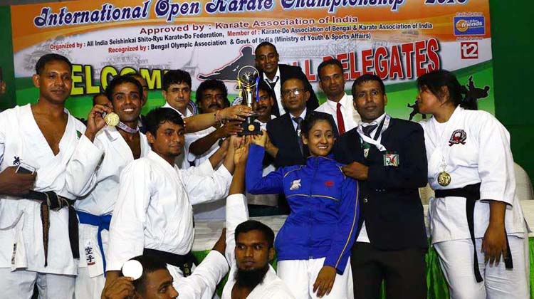 Members of Bangladesh Karate team, the champions of the International Open Karate Championship celebrate with the trophy. The Competition was held in Kolkata recently.