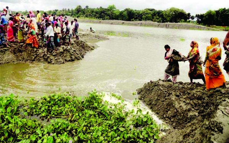 Over 100 villages went under flood-water as 200-meters of flood control embankment on the Kapotakkhya River washed away recently due to heavy rains and onrush of water from the upstream for the past few days.Local people are frantically trying to control