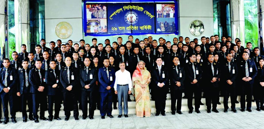 Prime Minister Sheikh Hasina poses for photograph with the members of Special Security Force (SSF) on the occasion of 29th founding anniversary of SSF at its Mess in the city's Tejgaon on Thursday. BSS photo