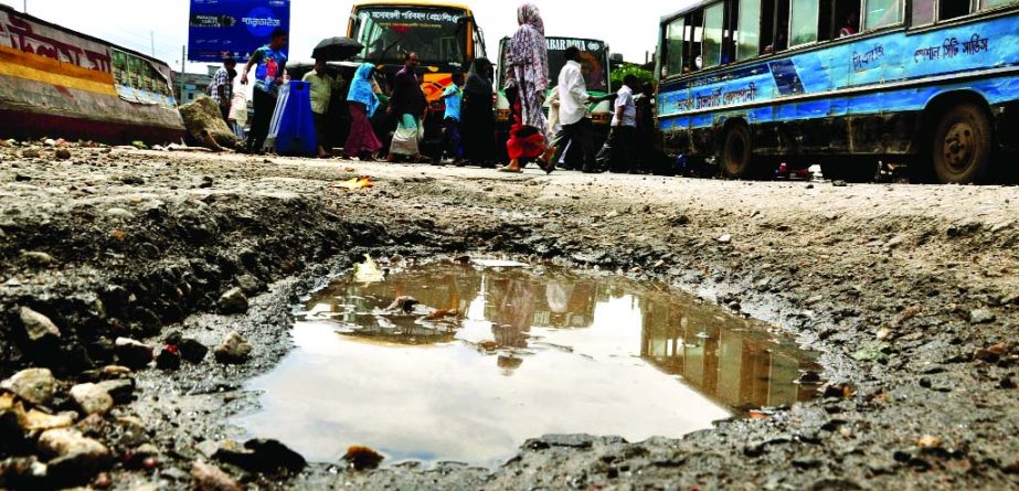 A ditch has developed in front of a bridge at Sanir Akhra on Dhaka-Ctg Highway threatening untoward incident at anytime. This photo was taken on Thursday.