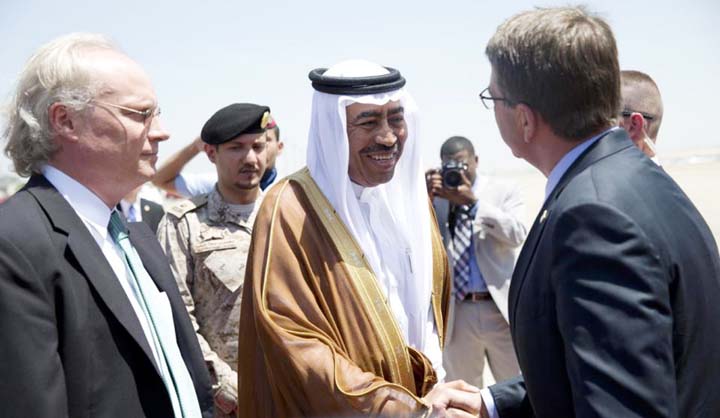 U.S. Defence Secretary Ash Carter, right, is greeted by Saudi Arabian Assistant Minister of Defense Mohammad Al-Ayesh, center, as Tim Lenderking U.S. Embassy Deputy Chief of Mission stands left, after his arrival military aircraft at King Abdulaziz Intern