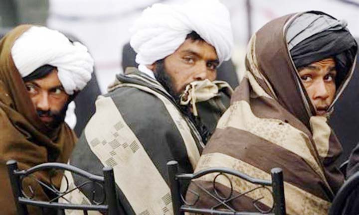Taliban fighters seen at a location between Pakistan and Afghan border.