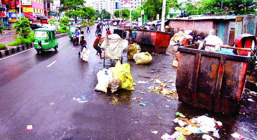 Garbage littered on the middle of the road spreading stench which causes disturbance for the road users. The situation remains the same for long but the authority concerned seemed to be blind to protect the road users from this nuisance. The snap was take