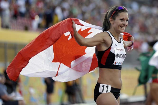Canada's Lanni Marchant celebrates after winning the bronze medal in the Women's 10,000 meter run at the Pan Am Games in Toronto on Thursday.