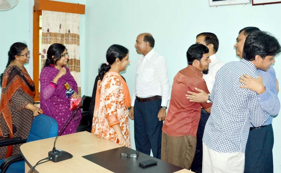 Teachers exchanging Eid greetings after opening of CUET yesterday.