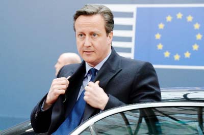 British Prime Minister David Cameron leaves a meeting place in London.