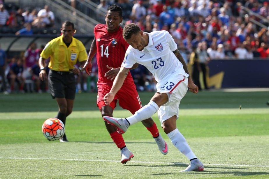 Fabian Johnson (23) of the United States shoots in front of Miguel Camargo (14) of Panama in the first half during the CONCACAF Gold Cup Third Place Match at PPL Park in Chester, Pennsylvania on Saturday.