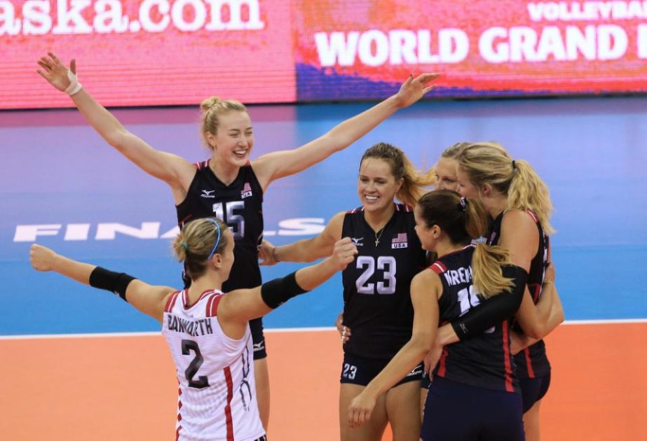 United States players, including Kayla Banwarth (2), Kimberly Hill (15) and Kelsey Robinson (23), celebrate their win over Brazil in a women's FIVB World Grand Prix volleyball match in Omaha, Neb on Saturday.