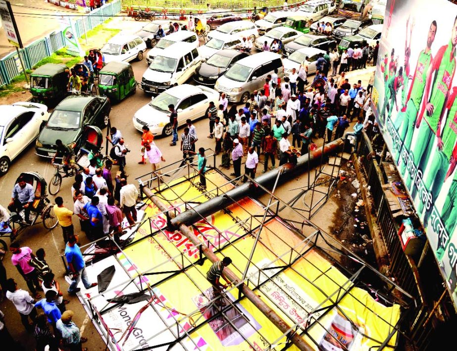 A large billboard near Shapla Chattar at Motijheel area collapsed on Sunday creating obstruction in the movements of commuter as well as vehicles.