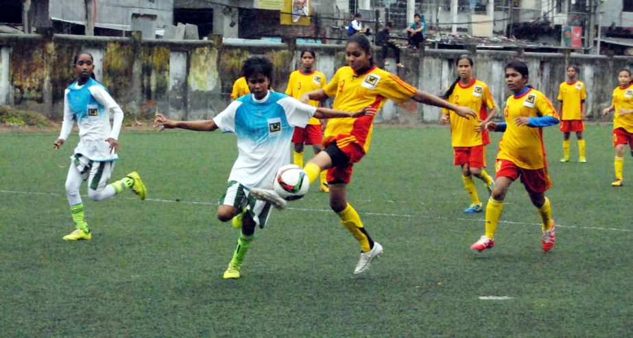 A scene from JFA U-14 Women's National Football Championship2015 between Mymensingh Womenâ€™s District team and Khulna Womens District team at BFF Artificial Football ground on Monday. Mymensingh Womenâ€™s District team won the match by