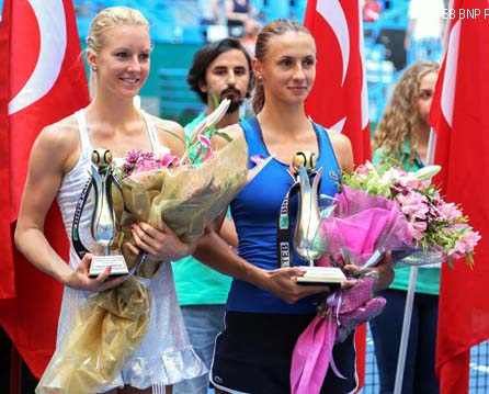 Lesia Tsurenko of Ukraine (right) and Urszula Radwanska of Poland (right) pose with the tropies after the final of the Istanbul Cup in Turkey on Sunday.