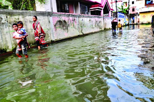 Many low-lying areas have gone under knee keep water following incessant rains for the last few days. This snap was taken from Merajnagar in Demra on Tuesday.