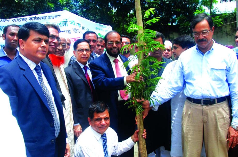 Md Habibur Rahman, Managing Director of Al-Arafah Islami Bank Ltd, inaugurating 'Tree Plantation Campaign 2015' under its Green Banking programme at Noyabazar Degree College premises, Keraniganj in Dhaka on Wednesday.