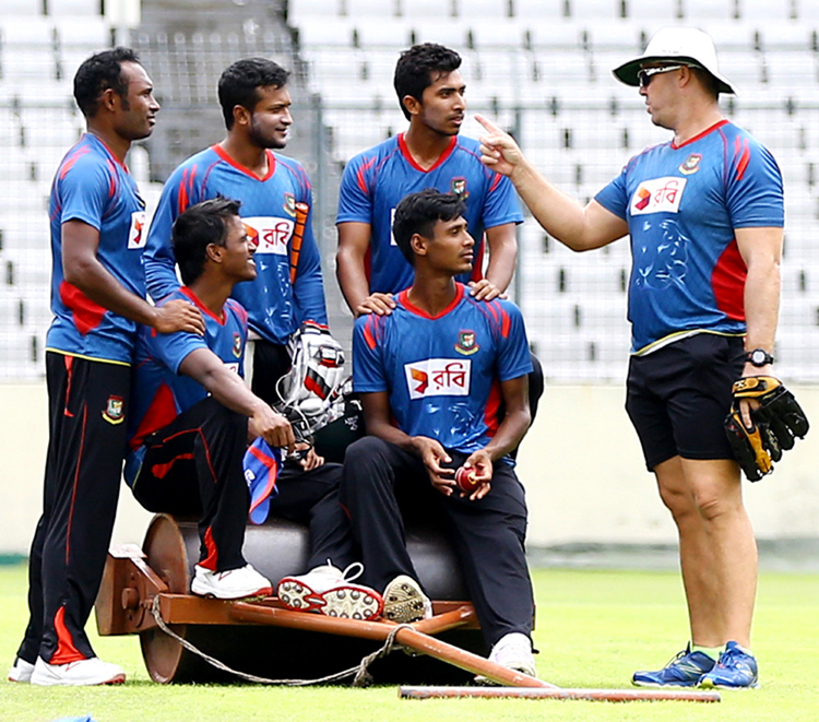 Bowling Coach of Bangladesh National Cricket team Heath Streak (right) giving tips to the players of Bangladesh National Cricket team at the Sher-e-Bangla National Cricket Stadium in Mirpur on Wednesday.