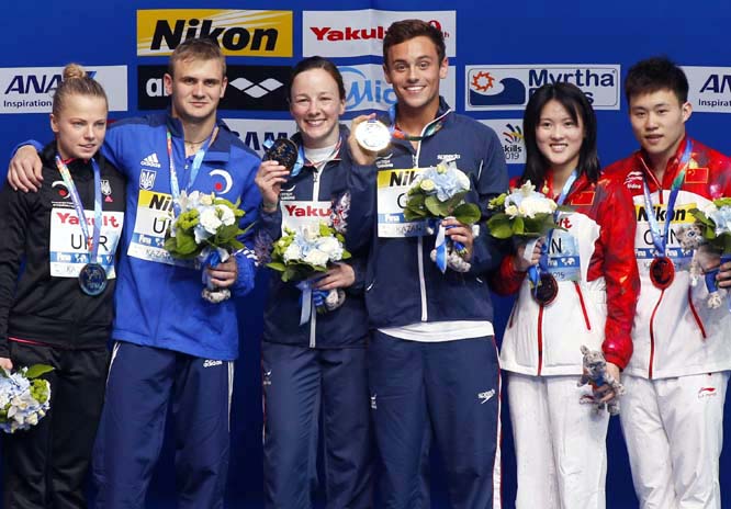 Silver medallists Ukraineâ€™s Oleksandr Gorshkovozov and Iuliia Procopchuk (left) gold medallists Britainâ€™s Rebecca Galantree and Thomas Daley (center) and bronze medallists Chinaâ€™s Siyi Xie and Ruolin Chen celebrate after Team Event di