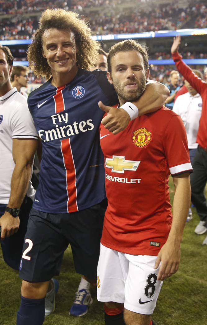 Paris Saint-Germain (PSG) defender David Luiz (left) leaves the stadium next to Manchester United defender Juan Mata (right) after the International Champions Cup soccer match in Chicago on Wednesday. PSG won the match 2-0.