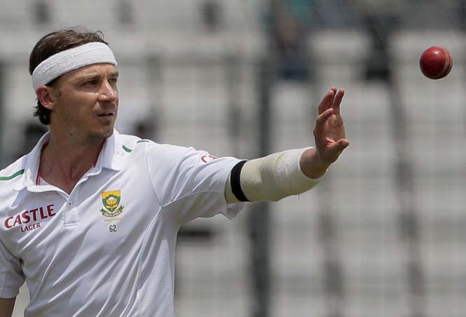 South Africaâ€™s Dale Steyn cups his hand to take the ball as he prepares to start his run to deliver the bowl during their first day of the second cricket Test match against Bangladesh at the Sher-e-Bangla National Cricket Stadium in Mirpur on Thur