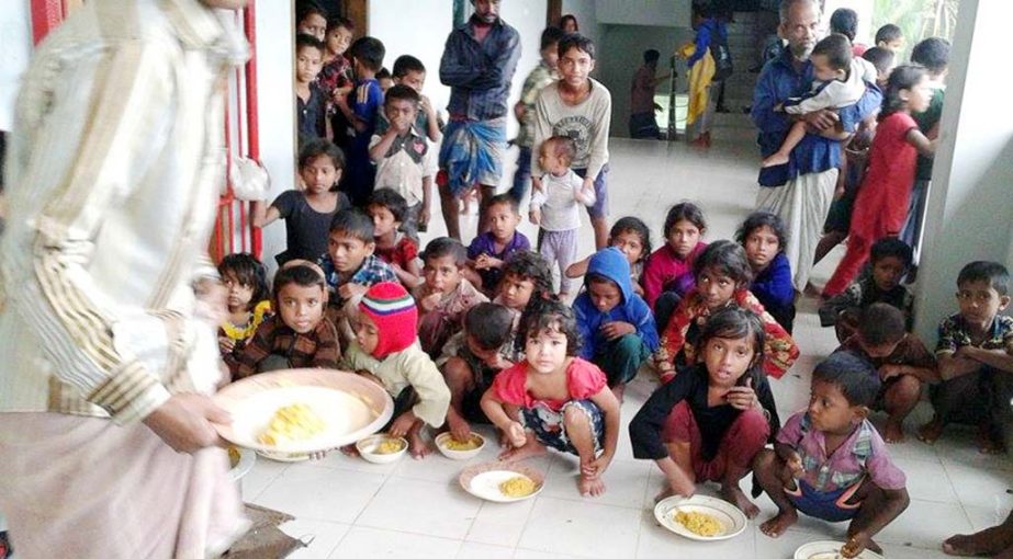 Children took shelter at Saint Martin cyclone shelter and they were served food on Thursday.