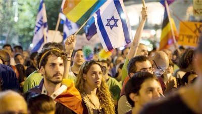 Hundreds of Israelis staged a protest rally in Jerusalem against the West Bank arson attack and stabbings at a Gay Pride march.