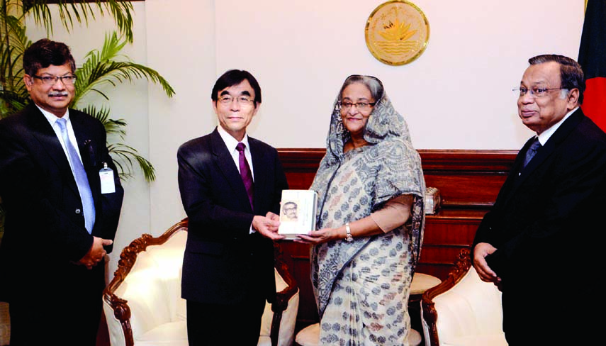 Mr. Kazuhiro Watanabe of Bengali Department of the Japanese Broadcasting Corporation (NHK) handing over copy of Japanese translation of The Unfinished Memoirs of Bangabandhu to Prime Minister Sheikh Hasina at her office on Sunday. Photo-BSS