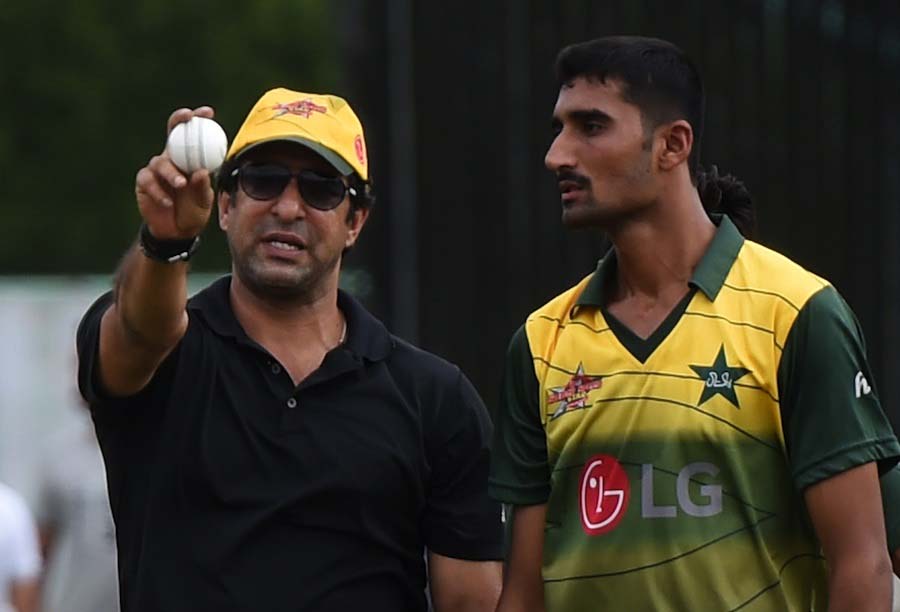 Pakistani cricket legend, Wasim Akram (L) gives tips to a youngster on the 13-day camp under the Pakistan Cricket Board in Karachi on Saturday. Pace legend Wasim Akram said he was confident Pakistan's pool of young fast bowling talent would secure thei