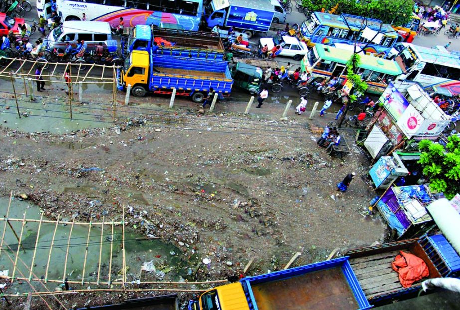 Trucks parked around the Shishu Park illegally in the city's English Road harming the beauty of the park severely but the authority concerned remains silent to take any necessary action against it. The snap was taken on Monday.