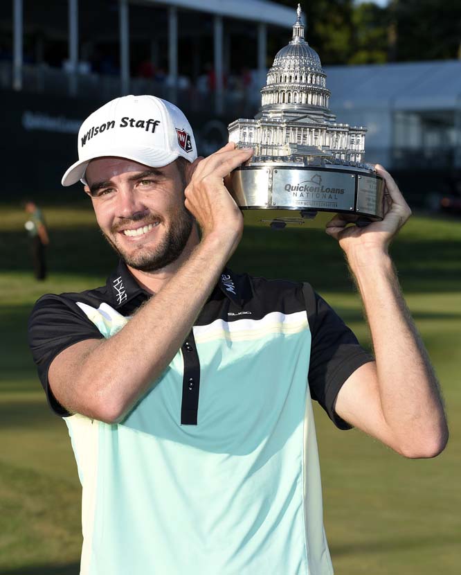 Troy Merritt poses with the trophy after he won the Quicken Loans National golf tournament at the Robert Trent Jones Golf Club in Gainesville on Sunday .