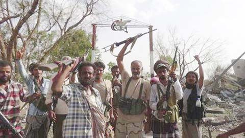 Fighters loyal to Yemen's President Abd-Rabbu Mansour Hadi gather outside the al-Anad military and air base in the country's southern province of Lahej.