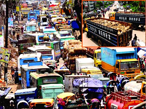 Hundreds of heavy and light vehicles remain stuck at Postagola area on Tuesday as owners and workers blocked the Buriganga Bridge-1, (inset right top) demanding toll-free movement of vehicles.