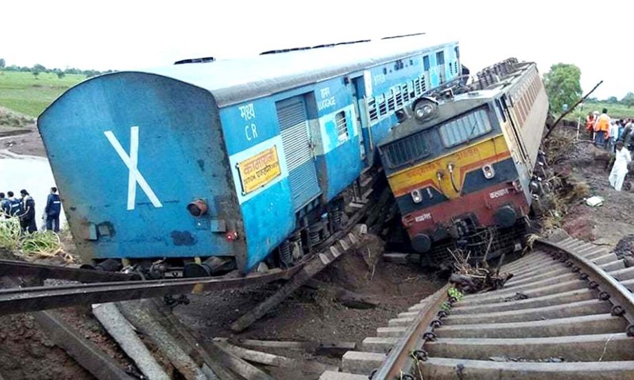 Two Indian passenger trains lay next to each other following derailments after they were hit flash flood on a bridge outside the town of Harda in Madhya Pradesh state on Wednesday.