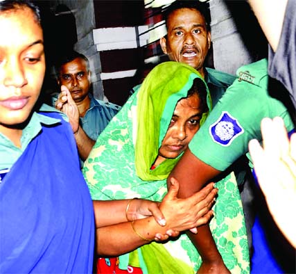 Beauty Begum, mother of prime accused of Rakib murder Omar Sharif, being taken on three-day remand in Khulna on Thursday. Banglar Chokh