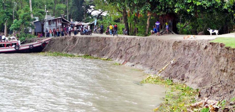 Galachipa Town Protection Embankment on the face of breaching any time due to strong tide of Agunmukha river. The town dwellers passing their days in panic. The snap was taken on Friday.