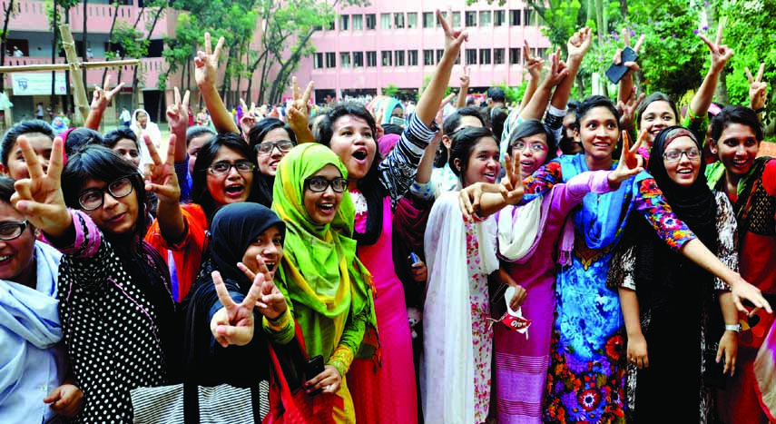 Students of Motijheel Ideal School and College celebrating their success at the HSC examination on Sunday.