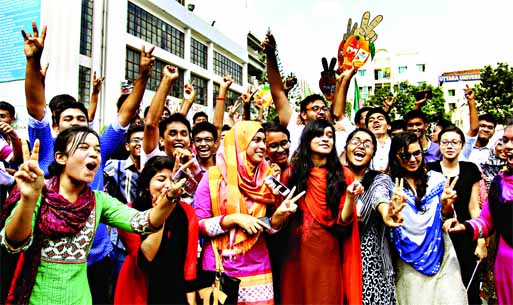 Students expressing happiness at Rajuk Uttara Model College after their HSC results were declared on Sunday.