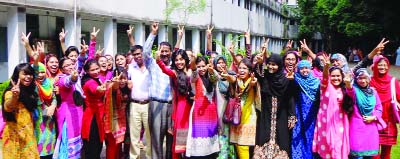 MYMENSINGH: Students and teachers of Mumununnesa Govt Mohila College celebrating their successful HSC results on Sunday.