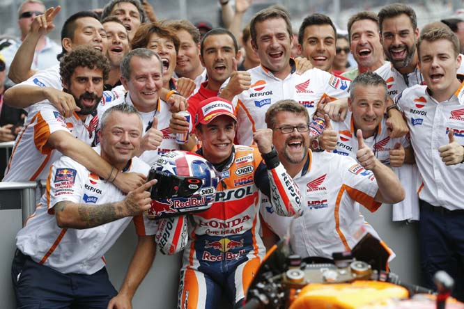 Marc Marquez (center front) of Spain celebrates with his team after winning the Indianapolis Grand Prix motorcycle race at Indianapolis Motor Speedway in Indianapolis on Sunday.