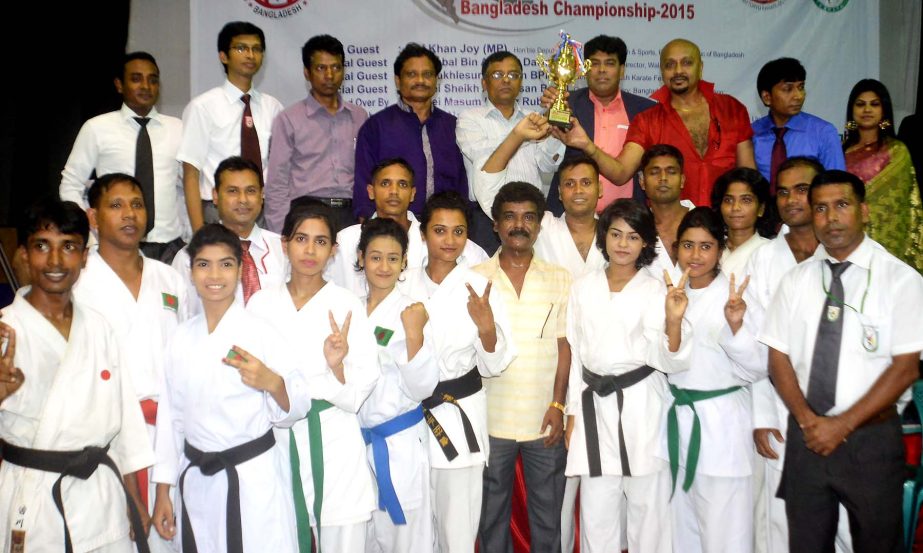 Champions and runners-up team of Walton 8th Shito-ryu Karate Do Championship pose for photo with the guests at the Gymnasium of National Sports Council on Monday.