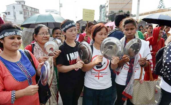 Nepalese activists bang plates and spoons as they protest in Kathmandu demanding equal citizenship rights in the new constitution on Monday.